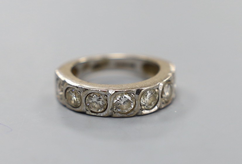 A modern 18ct white gold and seven stone diamond set half hoop ring, size J/K, gross weight 5.8 grams